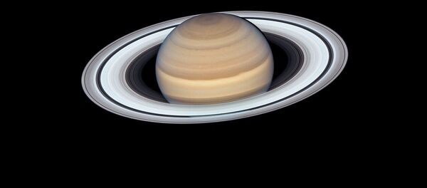 Снимок Сатурна, сделанный при помощи телескопа Хаббл Снимок Сатурна, сделанный при помощи телескопа Хаббл - Sputnik Кыргызстан