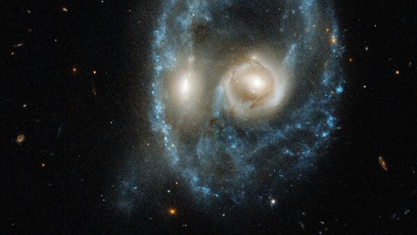 Столкновение двух галактик в 704 миллионах световых лет от Земли - Sputnik Кыргызстан