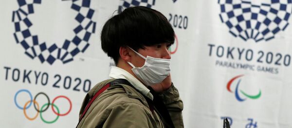 Токио шаарында киши коопсуз бет капчан. Архив - Sputnik Кыргызстан