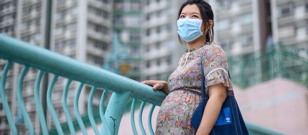 Беременная женщина в медицинской маске. Архивное фото - Sputnik Кыргызстан