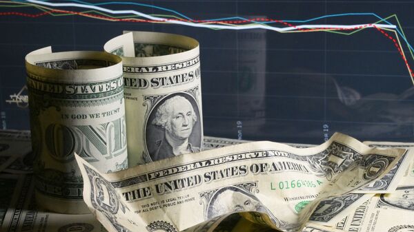 Купюры долларов США на фоне графика. Иллюстративное фото - Sputnik Кыргызстан