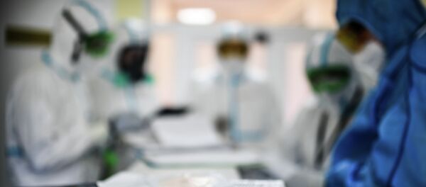 Врачи в госпитале для лечения зараженных коронавирусной инфекцией COVID-19. Архивное фото - Sputnik Кыргызстан