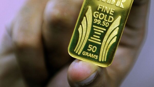 Слиток золота весом 50 грамм. Архивное фото - Sputnik Кыргызстан