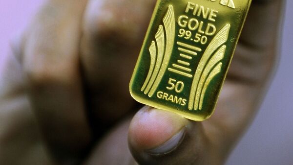 Слиток золота весом 50 грамм. Архивное фото - Sputnik Кыргызстан