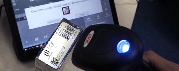 Сканер штрих-кода считывает маркировку товара. Архивное фото - Sputnik Кыргызстан